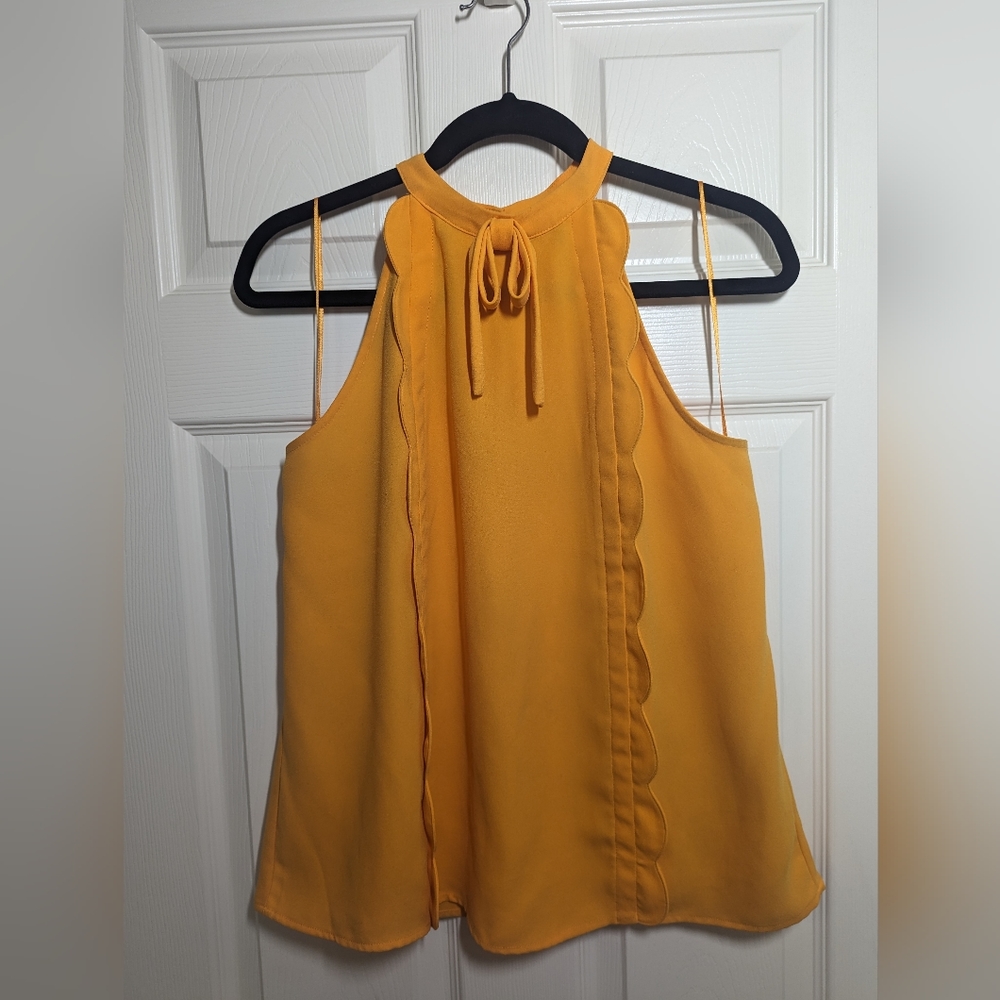 Sleeveless yellow blouse